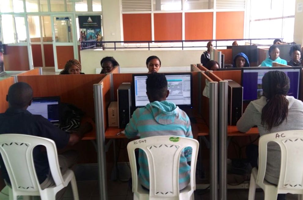 Learning Circle in action in Nakuru Public Library (Kenya). Learning Circles are in-person study groups for online learners.
