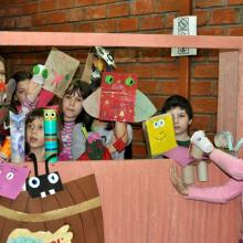 Children conducting a puppet show in Public Library ‘Radislav Nikčević’. They base the pubbet show on texts they have been reading.