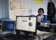 A person with print disability working at a computer.