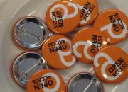 A group of lapel buttons, with the words Open Access. 