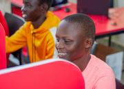 Young women in learning in a booth in Koboko Public Library's new computer lab. 