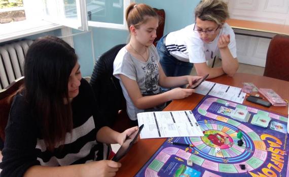 kids playing financial games on table