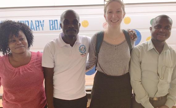 Alex Halloran with the library and teaching team in Ho: names, from the left, Seva, Charles, Alix, and David, standing in front of the library van.