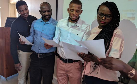 A group of trainee trainers learn training skills in a workshop in Namibia.