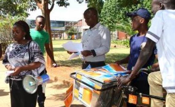 Student open access campaigners at Harare Institute of Technology used a megaphone to broadcast messages and a bicycle to distribute pamphlets during Open Access Week 2015. Photo by Jasper Lee Maenzanise.