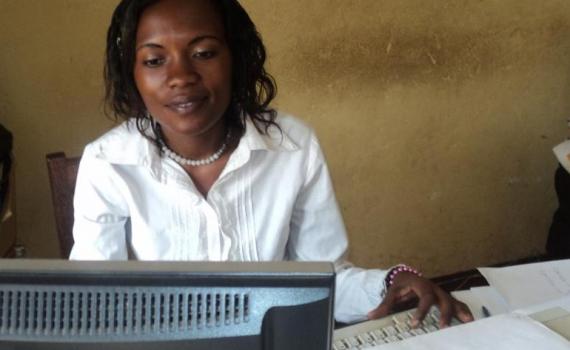 A nurse practising her computer skills in the library.