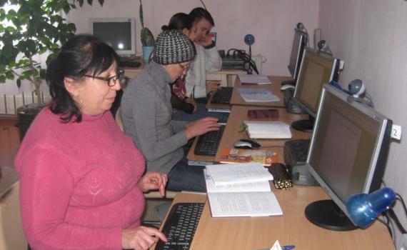 Citizens of Mykolaiv learn ICT and e-government skills in their local library. Citizens learning computer and e-government skills in their local library.