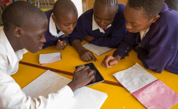 Children use tablet computers to access educational content linked to the school curriculum in Kibera Public Library. Children use tablet computers to access educational content linked to the school curriculum in Kibera Public Library.