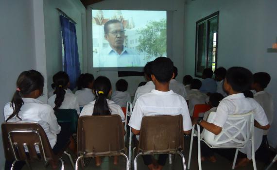 School children in Lveate Village watch filmed interviews with older villagers about their experience under the brutal Pol Pot regime. School children in Lveate Village watch filmed interviews with older villagers about their experience under the brutal Pol Pot regime.