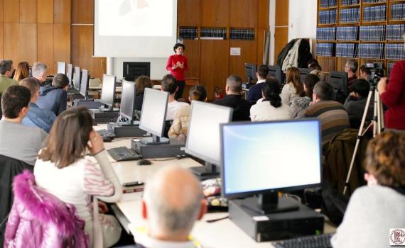 Editors of scientific journals attend an EIFL-KOBSON workshop in 2016 on how to improve OA journal websites. Journal editors working on computers during an EIFL-KOBSON workshop, while listening to an address by EIFL OA country coordinator in Serbia, Milica Ševkušić.