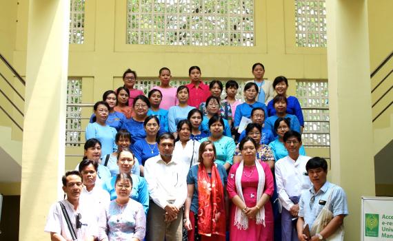 group photo of participants standing on stairs